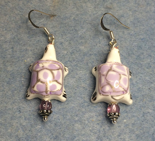 Violet and white ceramic spotted turtle bead earrings adorned with violet Czech glass beads.