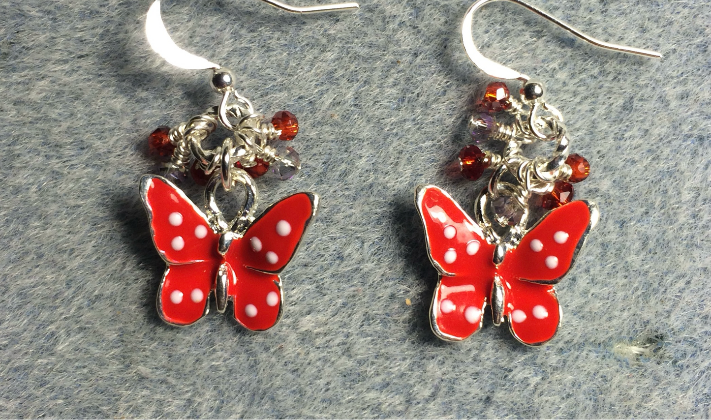 Red and white enamel spotted butterfly charm earrings adorned with tiny dangling red and clear Chinese crystal beads.