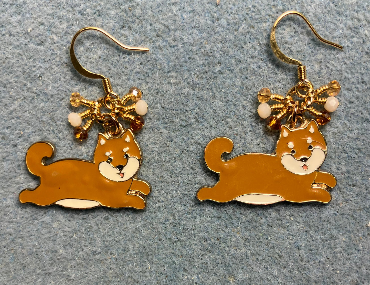 Brown and white enamel Shiba Inu charm earrings adorned with tiny dangling brown, white, and amber Chinese crystal beads.