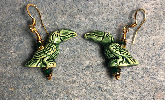 Dark green ceramic toucan bead earrings adorned with dark green Chinese crystal beads.