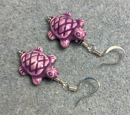 Purple ceramic turtle bead earrings adorned with purple Chinese crystal beads.