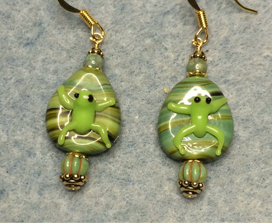 Lime green lamp work frog bead earrings adorned with lime green Picasso Czech glass beads.