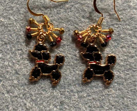 Black and red enamel poodle charm earrings adorned with tiny dangling black, red, and gold Chinese crystal beads.