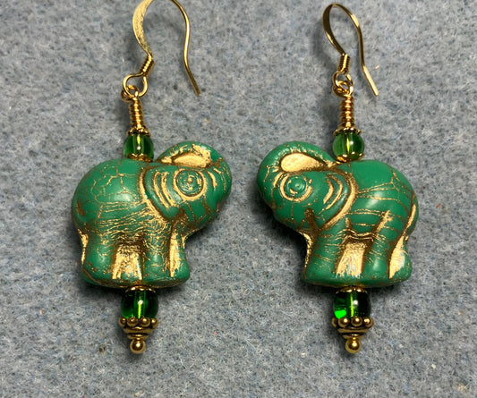 Green (with gold inlay) Czech glass elephant bead earrings adorned with green Czech glass beads.