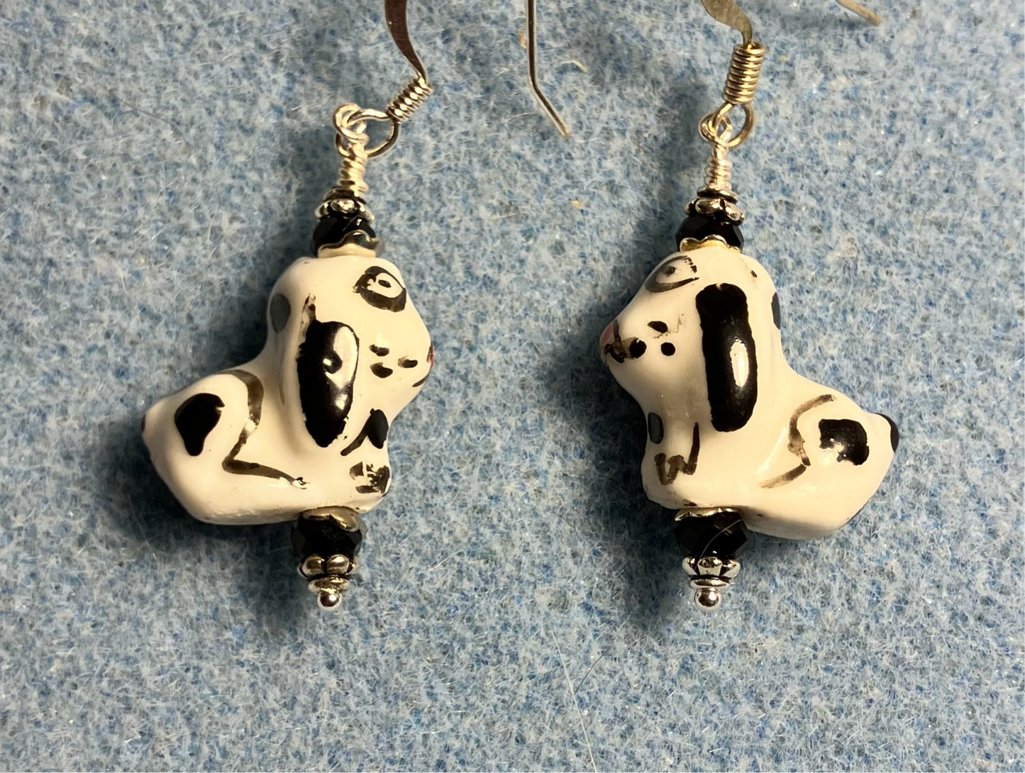 Black and white ceramic puppy dog bead earrings adorned with black Chinese crystal beads.