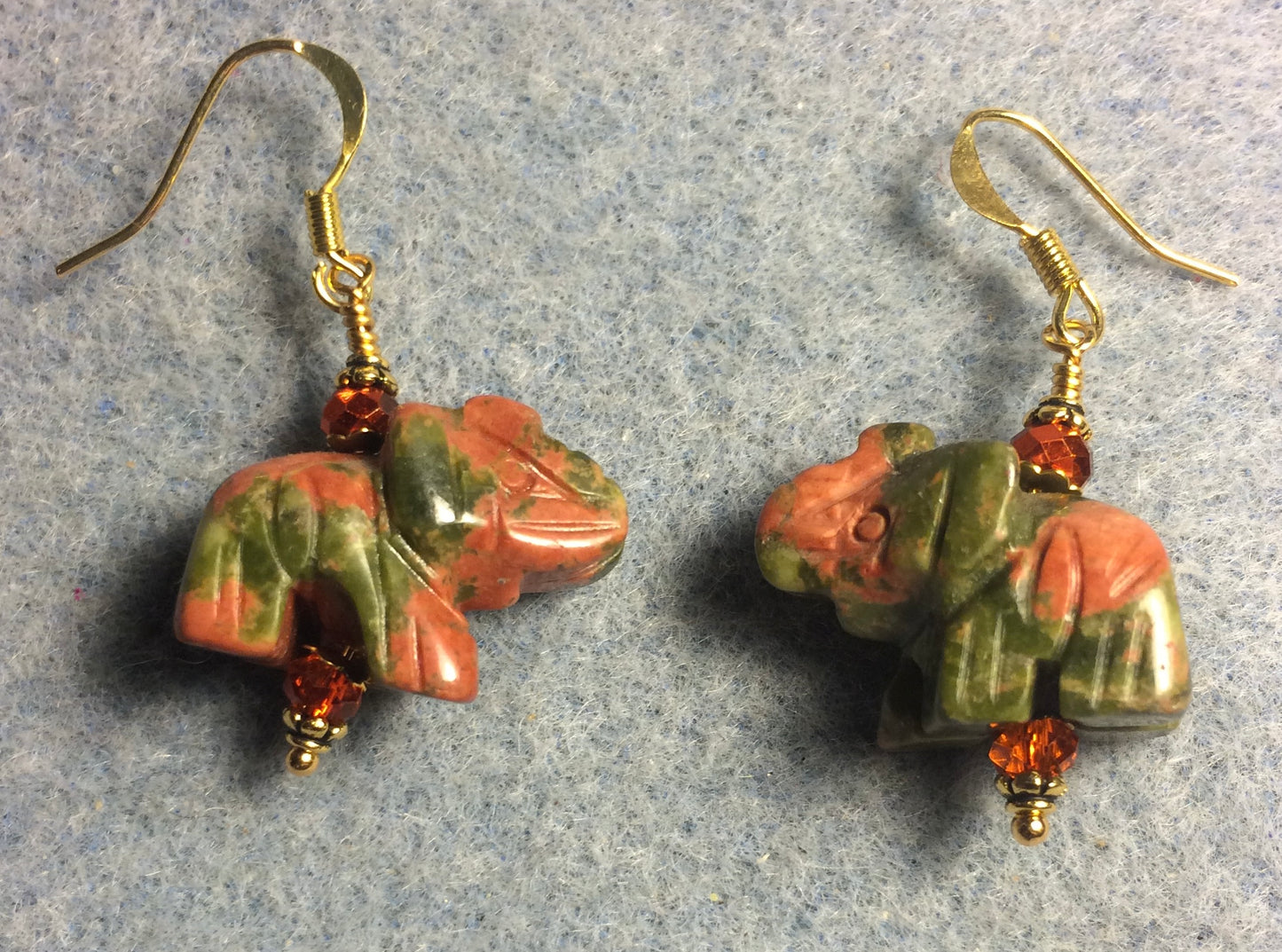 Orange and green unakite gemstone elephant bead earrings adorned with orange Chinese crystal beads.