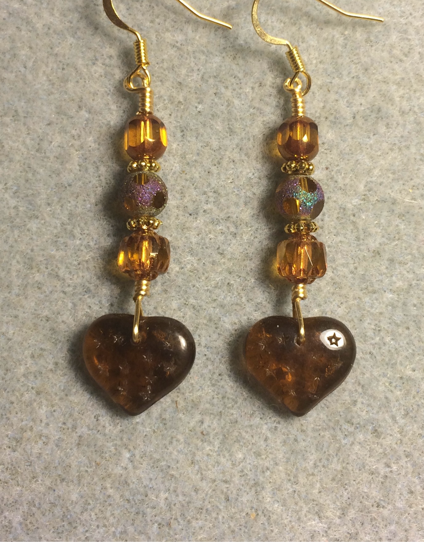 Dark topaz Czech glass heart bead earrings adorned with  topaz Czech glass beads.