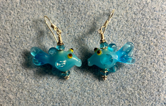 Turquoise lamp work fish bead earrings adorned with turquoise Chinese crystal beads.