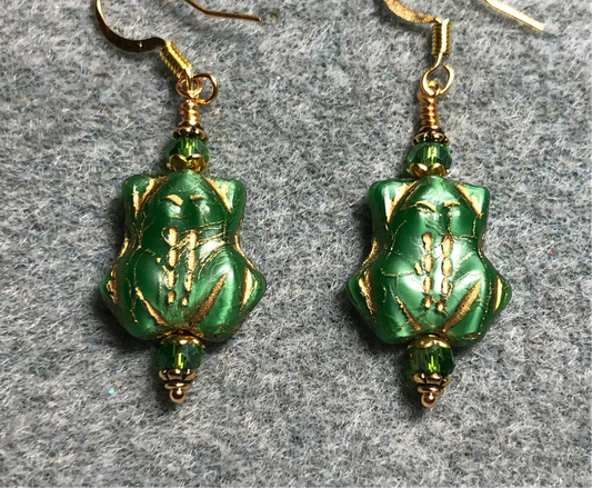 Green (with gold wash) Czech glass frog bead earrings adorned with green Chinese crystal beads.