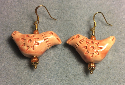 Large light orange ceramic songbird bead earrings adorned with orange Czech glass beads.