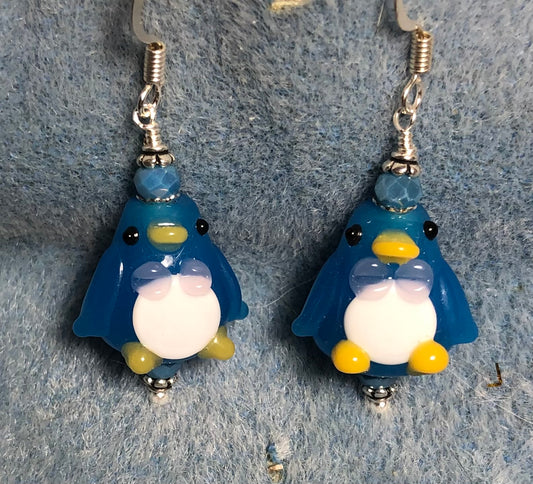 Opaque blue and white lamp work penguin bead earrings adorned with blue Chinese crystal beads.