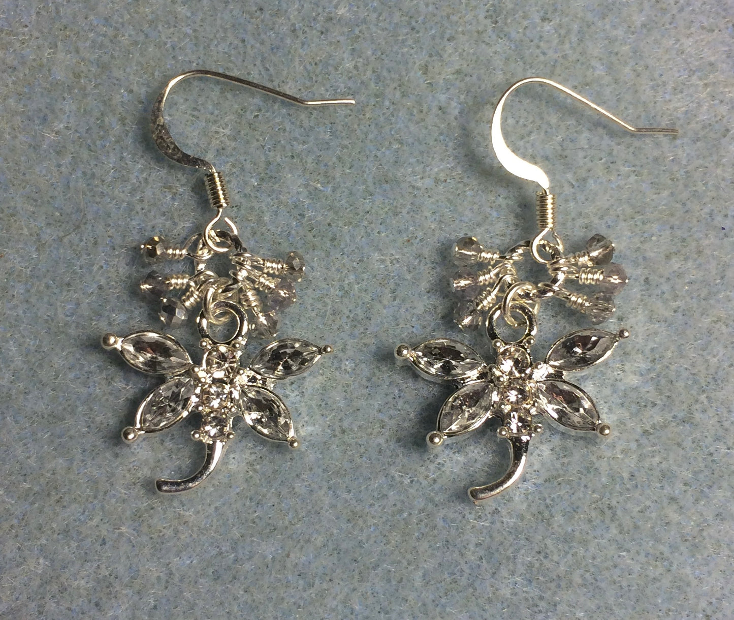 Clear and silver rhinestone dragonfly charm earrings adorned with tiny dangling clear and silver Chinese crystal beads.