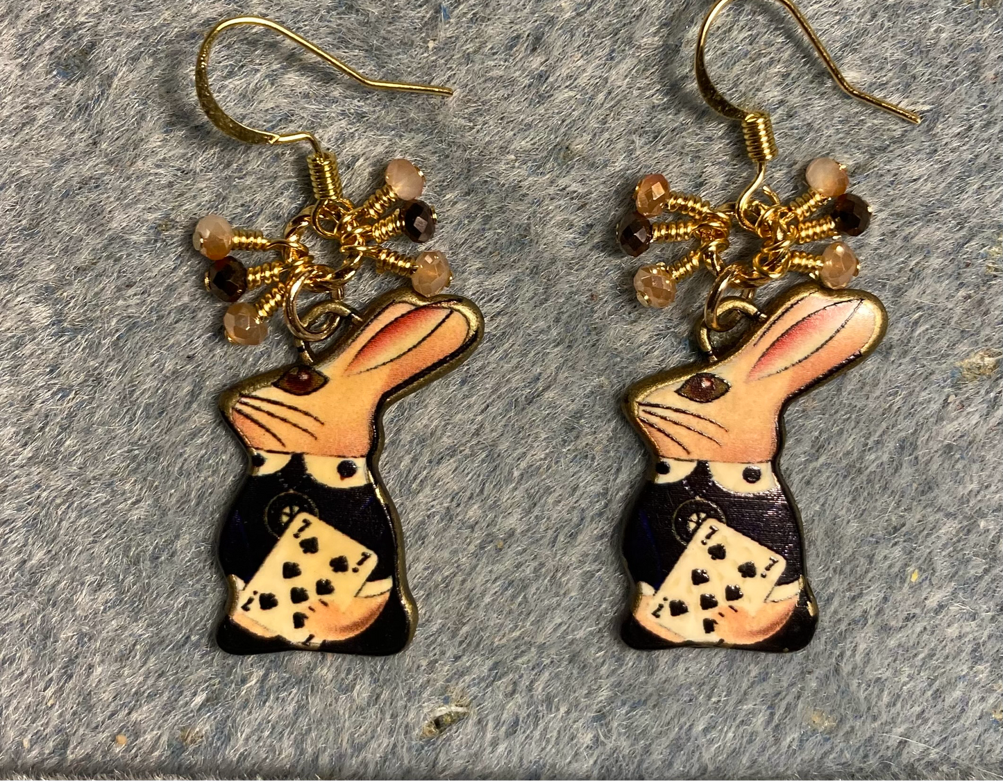 Brown, amber, and tan enamel rabbit charm earrings adorned with brown, amber, and tan Chinese crystal beads.