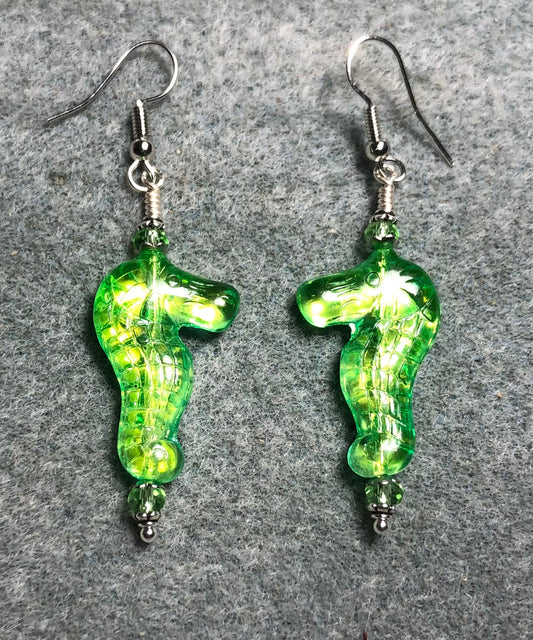 Shimmery green Czech glass seahorse bead earrings adorned with green Chinese crystal beads.
