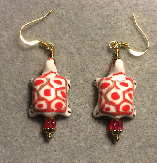 Bright red and white ceramic spotted turtle bead earrings adorned with bright red Czech glass beads.