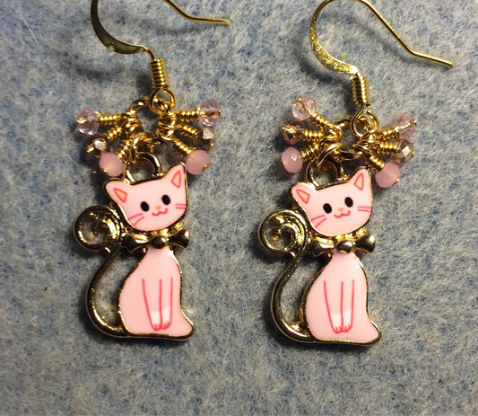 Pink enamel cat charm earrings adorned with small dangling pink and gold Chinese crystal beads.