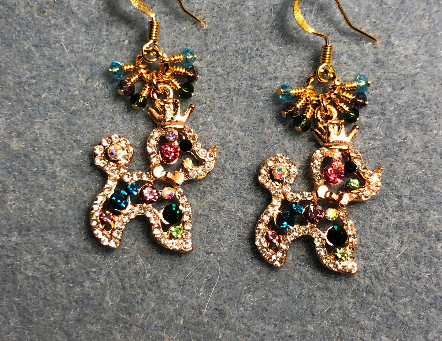 Aqua, purple, and green rhinestone poodle charm earrings adorned with tiny dangling aqua, purple, and green Chinese crystal beads.