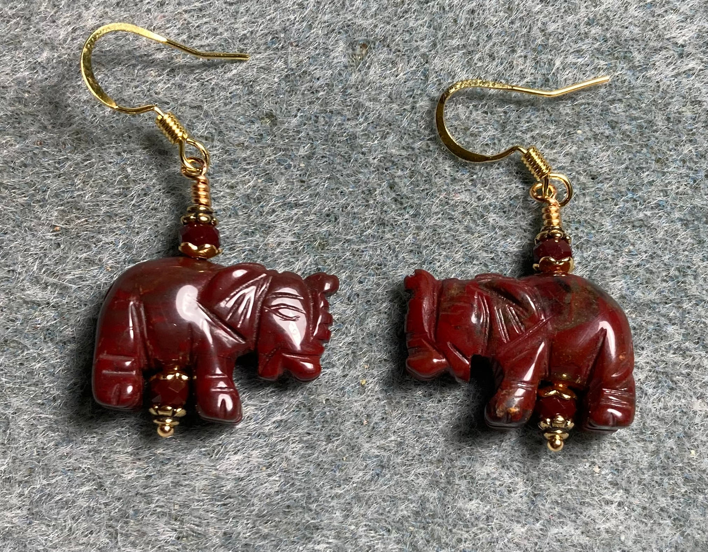 Red poppy jasper gemstone elephant bead earrings adorned with dark red Chinese crystal beads.