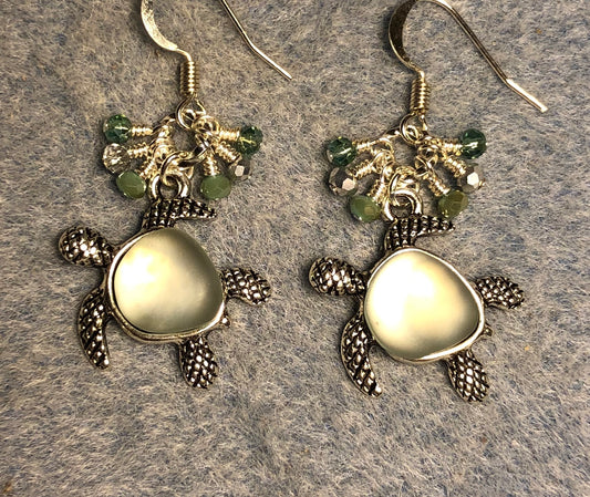 Silver and light green fiber optic turtle charm earrings adorned with tiny dangling light green and silver Chinese crystal beads.