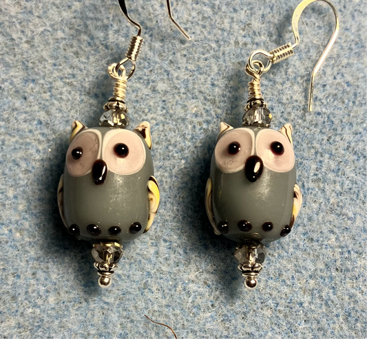 Gray lamp work owl bead earrings adorned with gray Chinese crystal beads.