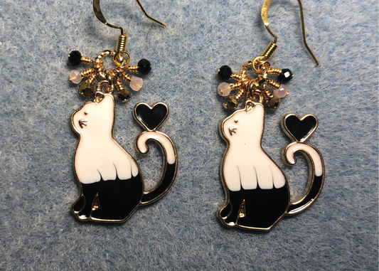 Black and white enamel cat charm earrings adorned with tiny dangling black and white Chinese crystal beads.