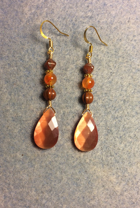 Orange fiber optic briolette bead earrings adorned with orange Czech glass beads.