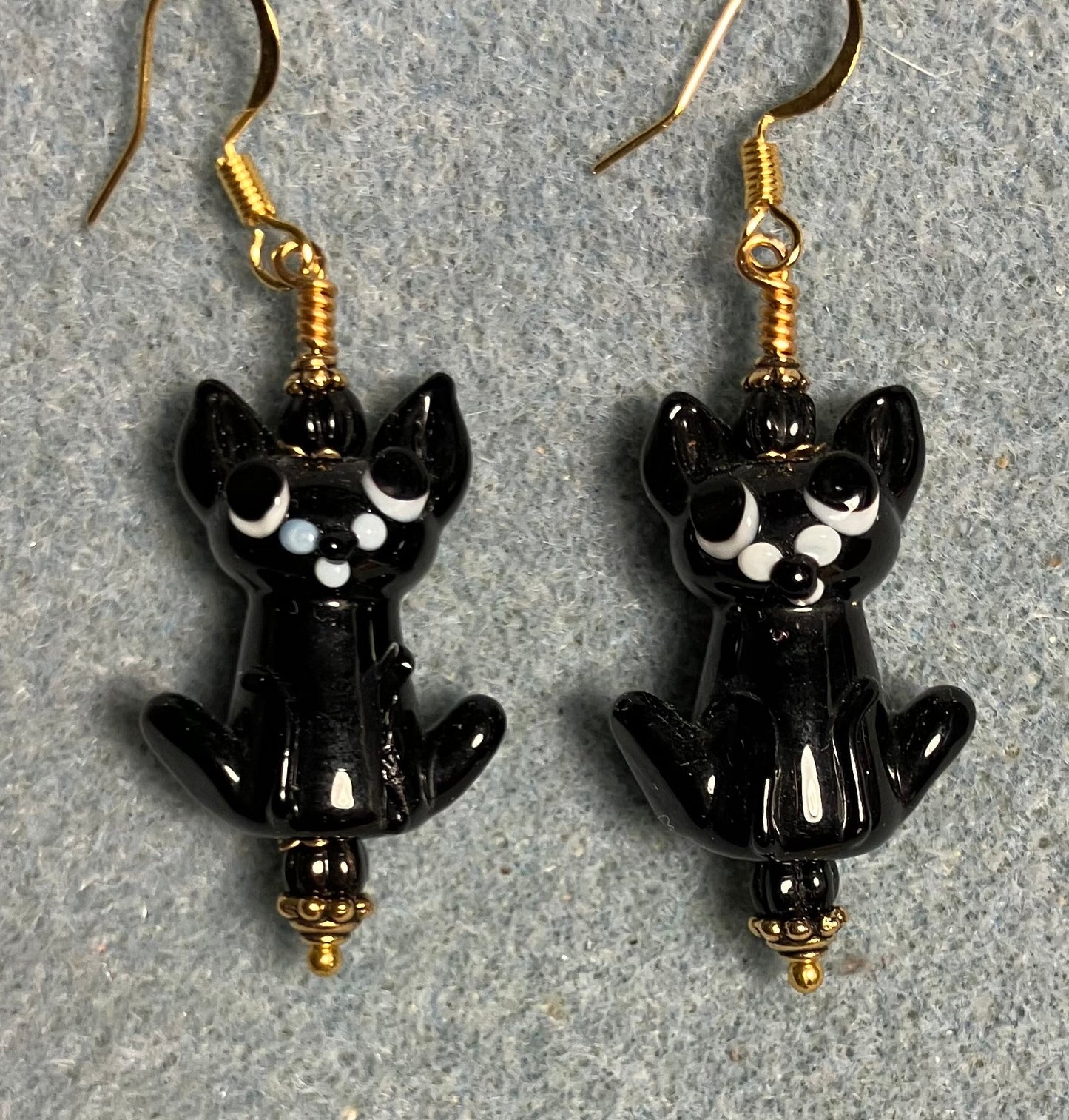 Opaque black lamp cat bead earrings adorned with black Czech glass beads.