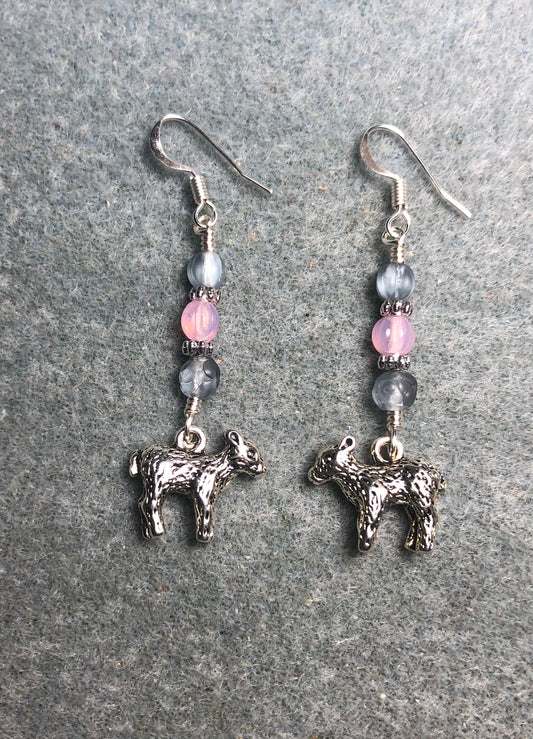 Small silver lamb charm earrings adorned with light blue and pink Czech glass beads.