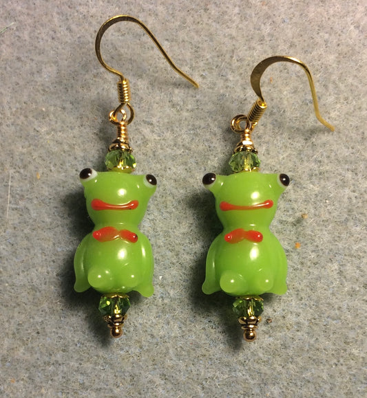 Opaque olive green lamp work silly frog bead earrings adorned with olive green Chinese crystal beads.