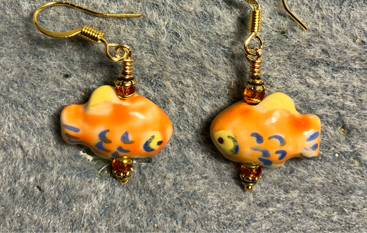 Small tangerine, yellow, and blue ceramic fish bead earrings adorned with tangerine Chinese crystal beads.