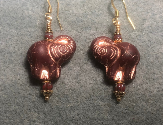 Dark red (with copper inlay) Czech glass elephant bead earrings adorned with dark red Czech glass beads.