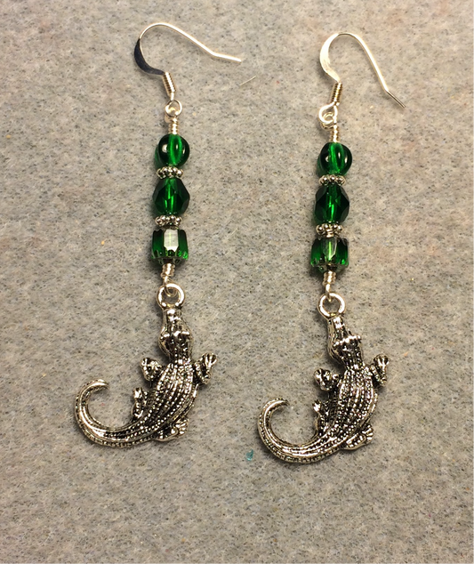 Silver alligator charm earrings adorned with emerald green Czech glass beads