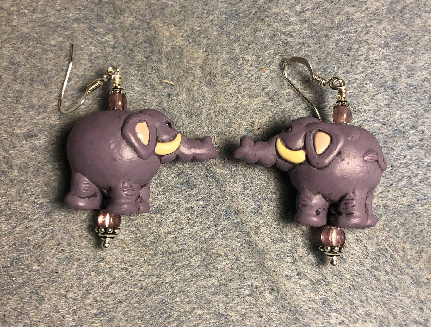 Purple ceramic elephant bead earrings adorned with purple Czech glass beads.