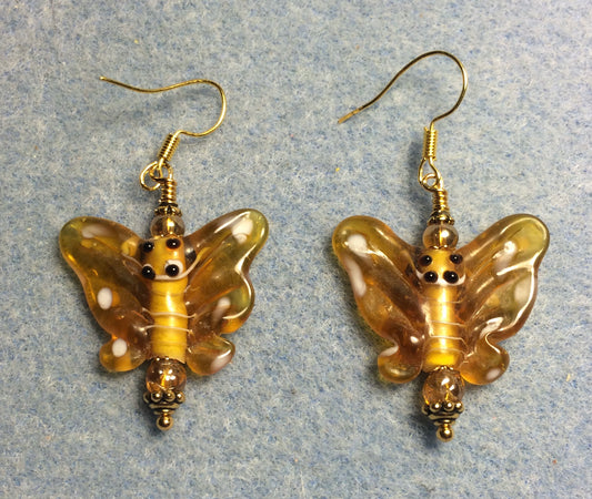 Topaz lamp work butterfly bead earrings adorned with topaz Czech glass beads.