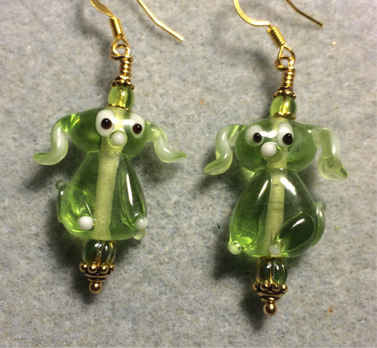 Translucent lime green lamp work floppy eared puppy dog bead earrings adorned with lime green Czech glass beads.