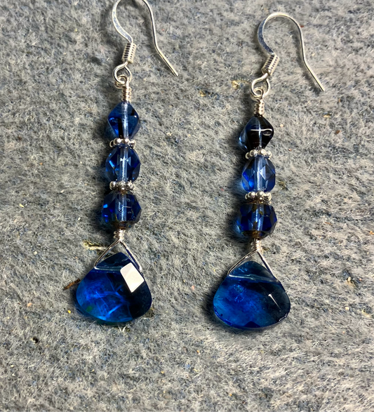 Capri blue Czech glass briolette bead earrings adorned with capri blue Czech glass beads.