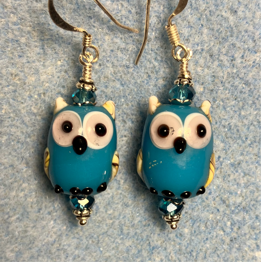 Turquoise lamp work owl bead earrings adorned with turquoise Chinese crystal beads.
