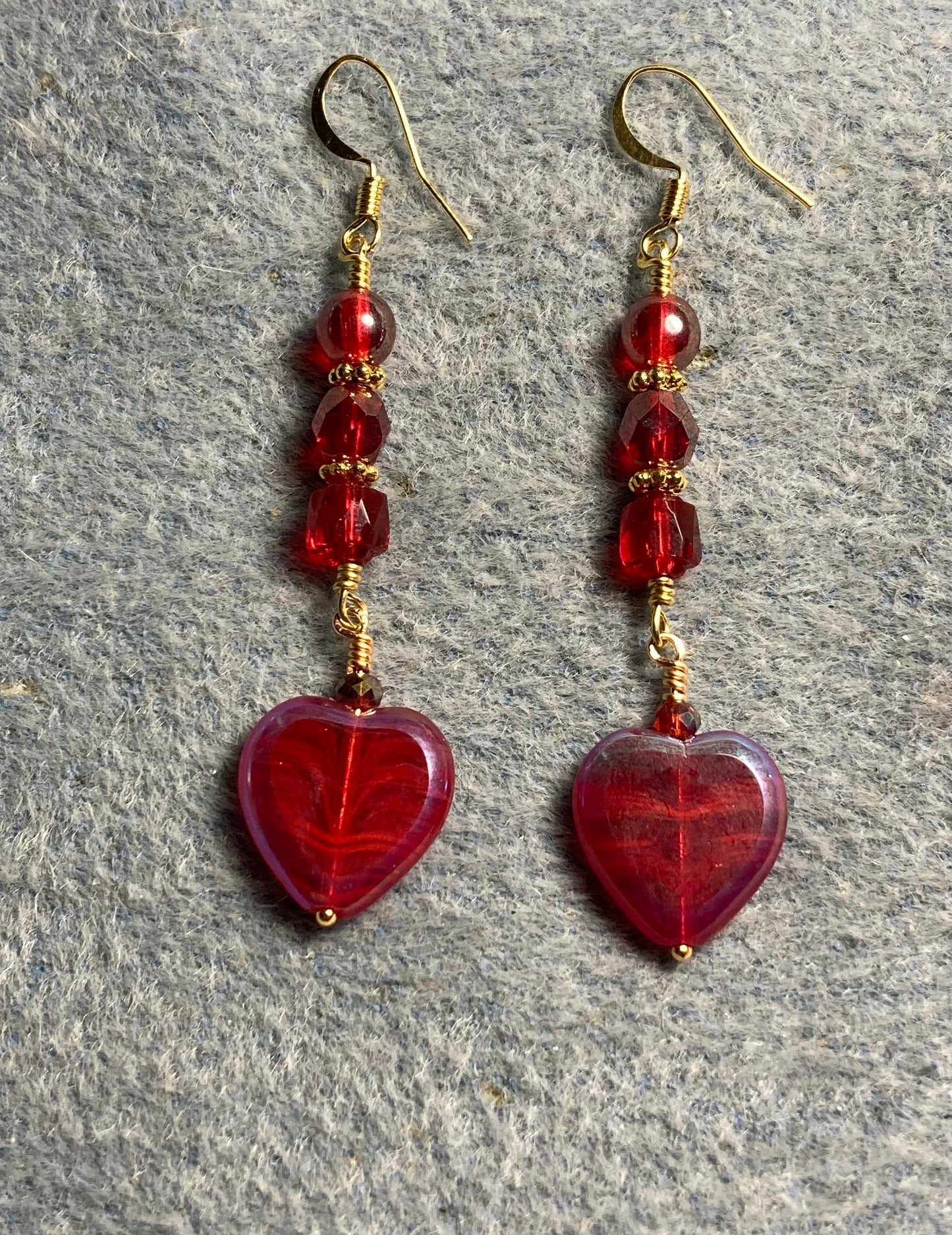 Dark red Czech glass heart bead earrings adorned with dark red Czech glass beads.