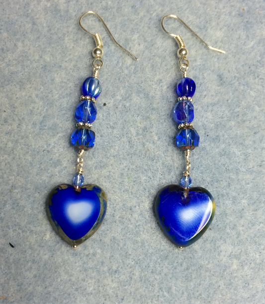 Opaque blue Czech glass heart bead earrings adorned with blue Czech glass beads.