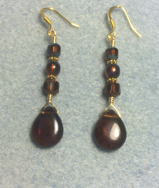 Translucent brown Czech glass pear drop bead earrings adorned with brown Czech glass beads.