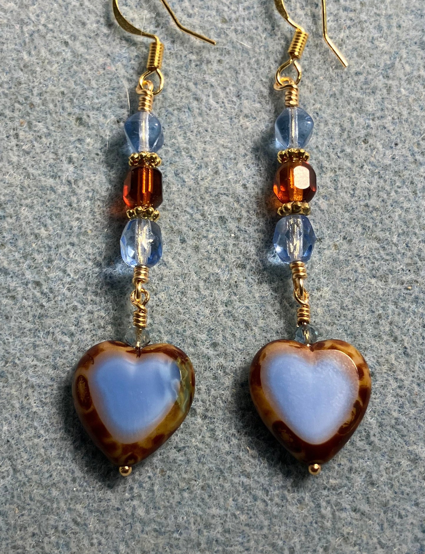 Light blue and brown Czech glass heart bead earrings adorned with light blue and brown Czech glass beads.