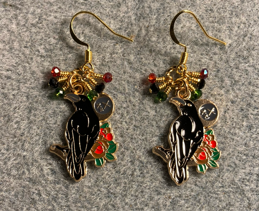 Black, red, and green enamel raven charm earrings adorned with tiny dangling black, red, and green Chinese crystal beads.