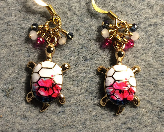 White and hot pink enamel turtle charm earrings adorned with tiny dangling white, hot pink, and dark blue Chinese crystal beads.