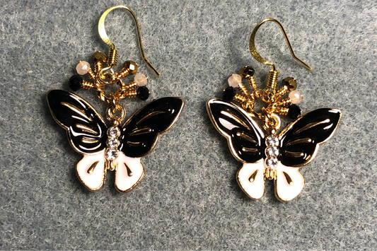 Black and white enamel and rhinestone butterfly charm earrings adorned with tiny dangling black, gold, and white Chinese crystal beads.