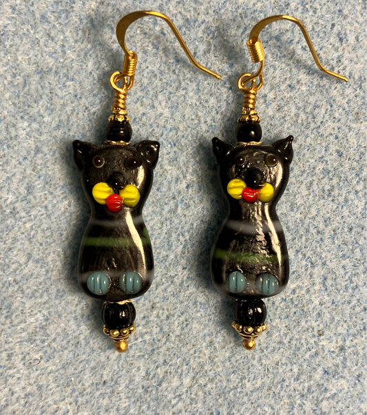 Black, yellow, and gray lamp work cat bead earrings adorned with black Czech glass beads.