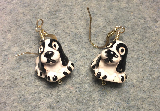 Small black and white ceramic Cocker Spaniel bead earrings adorned with black Chinese crystal beads.