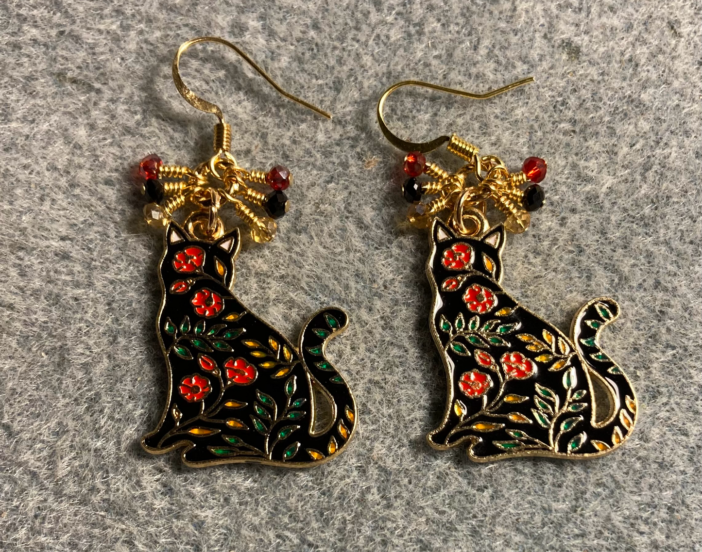 Black, red, and amber enamel cat charm earrings adorned with tiny dangling black, red, and amber Chinese crystal beads.