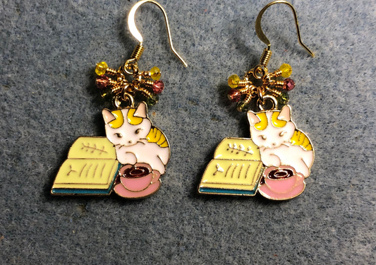 White, yellow, and pink enamel cat charm earrings adorned with tiny dangling yellow, pink, and green Chinese crystal beads.