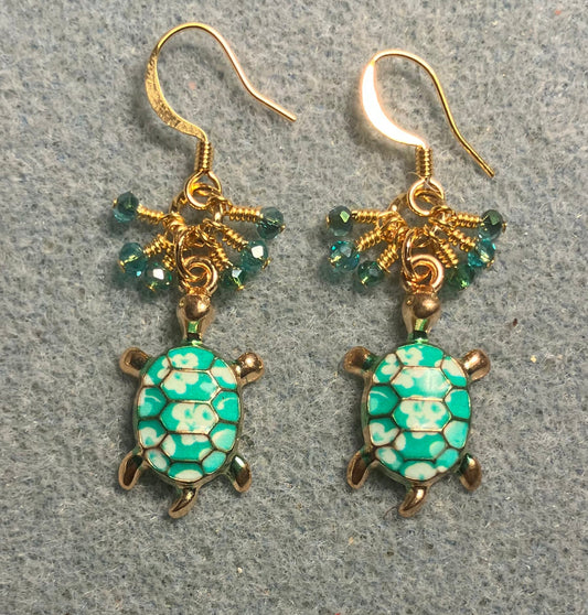 Teal and white enamel turtle charm earrings adorned with tiny dangling teal Chinese crystal beads.