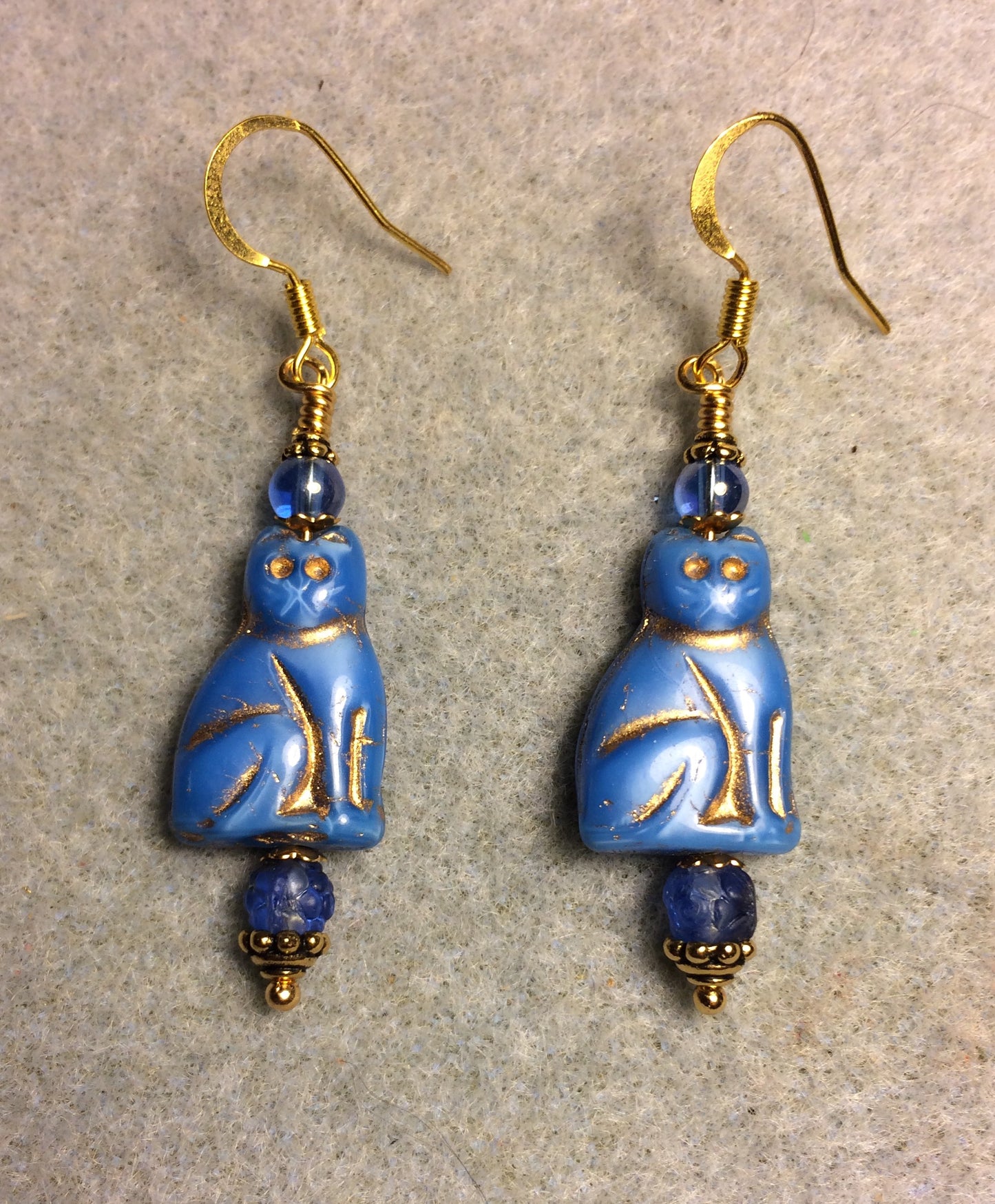 Capri blue (with gold inlay) Czech glass cat bead earrings adorned with capri blue Czech glass beads.